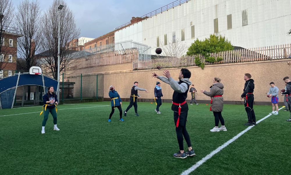 a group of young people participating in flag football programs in Ireland